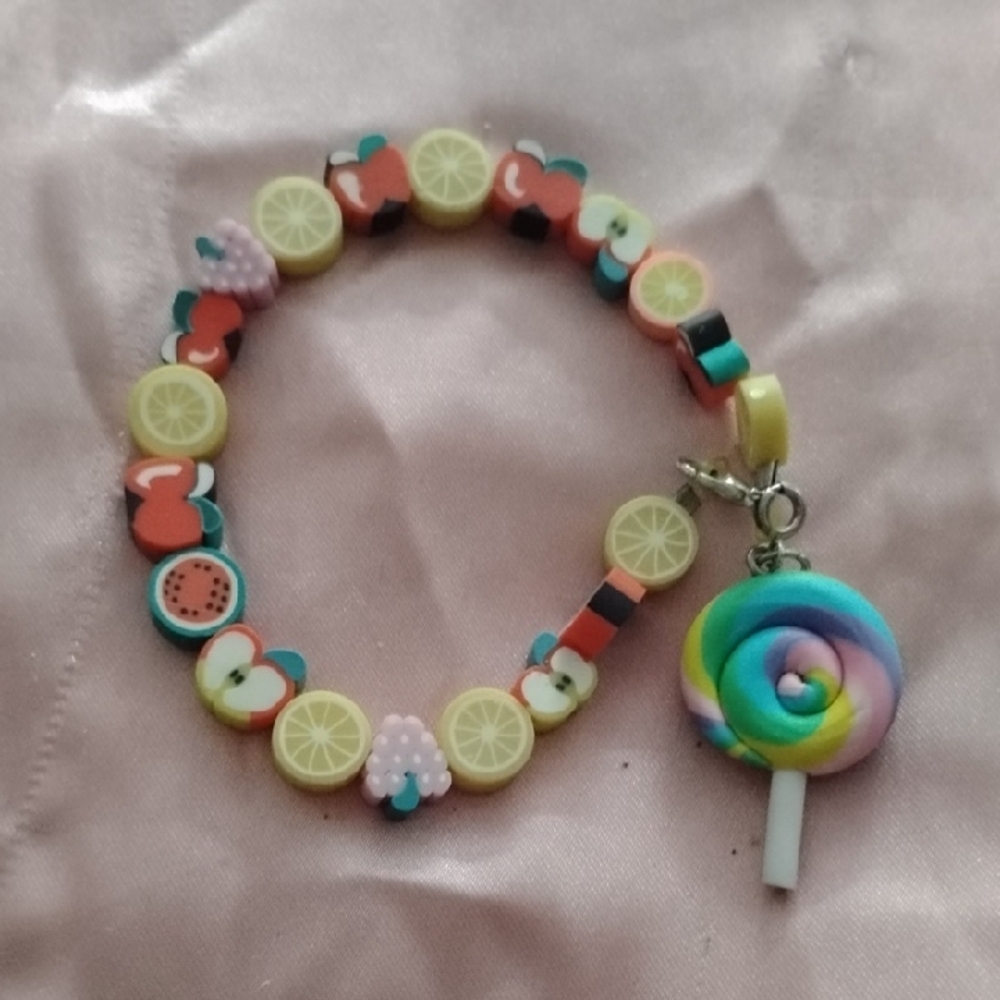 Yellow and Pink Beaded Bracelet with Swirl Charm